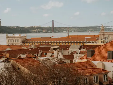 Lisbon's red roofs with the Tagus bridge